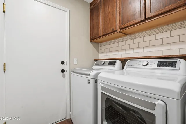 a utility room with dryer and washer