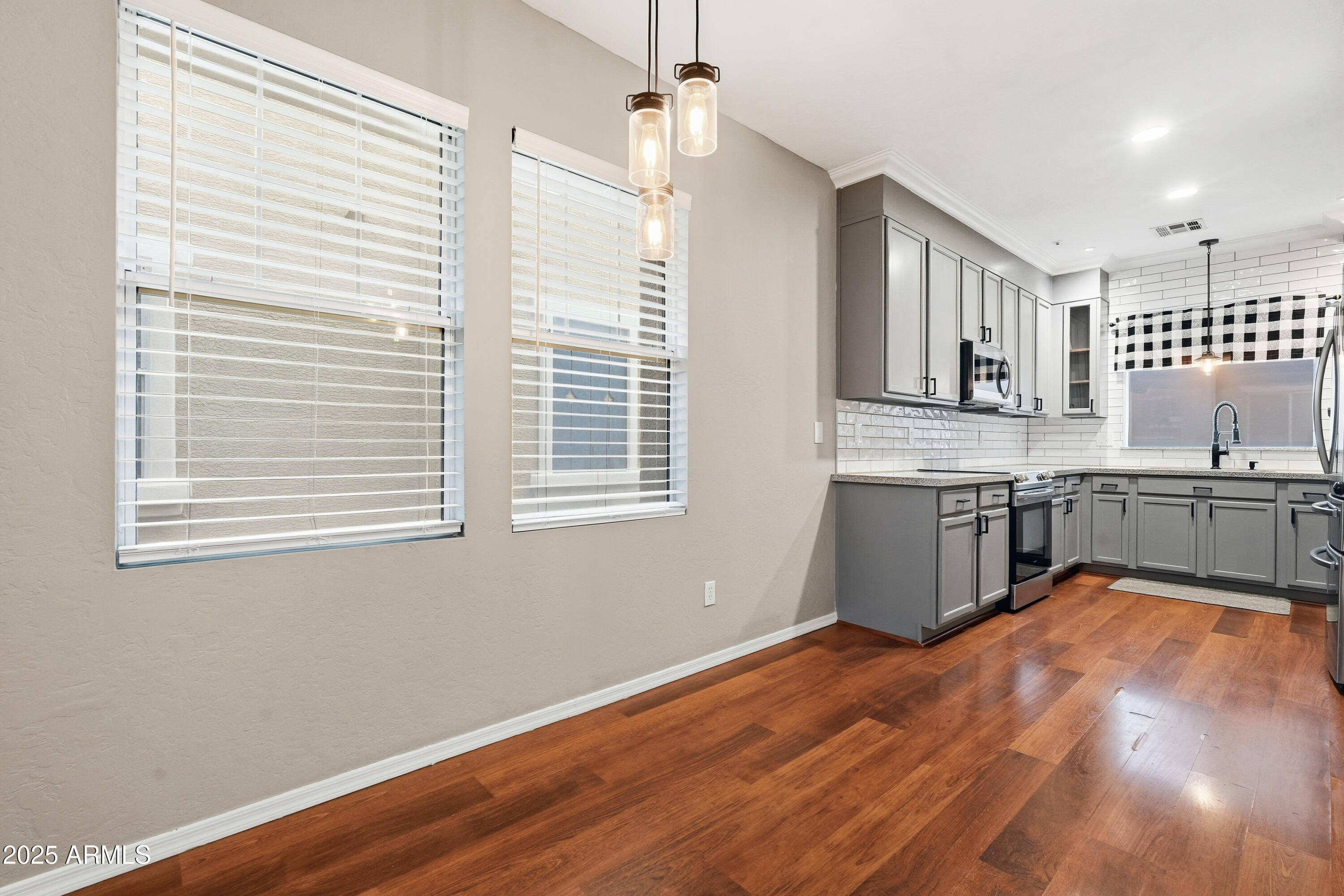 162 West Commerce Court Gilbert, AZ 85233 - Photo 9 of 29 a view of a kitchen with a sink cabinets and wooden floor
