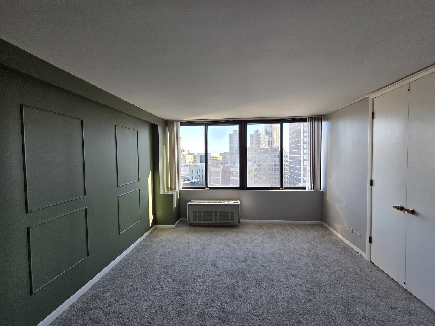 2754 North Hampden Court, Unit 1407 Chicago, IL 60614 - Photo 12 of 23 a living room with a large window and walk in closet