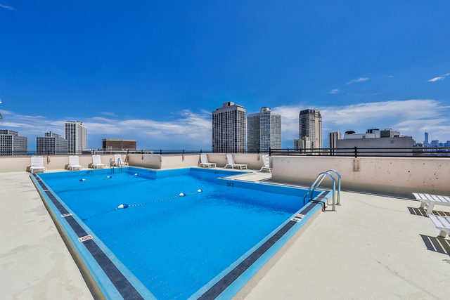 2754 North Hampden Court, Unit 1407 Chicago, IL 60614 - Photo 22 of 23 a view of a pool with chairs
