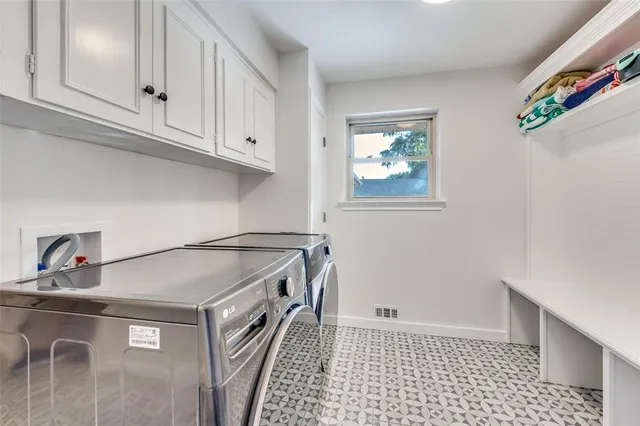 a kitchen with a cabinets and window