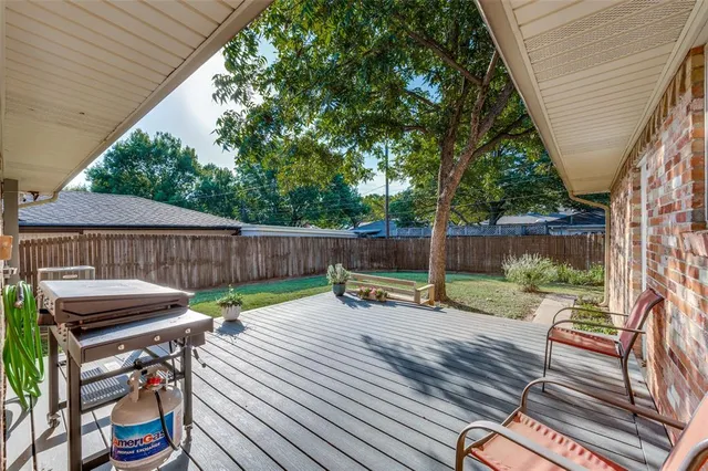 a view of chair and tables in the backyard