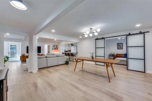 a living room with furniture and a table