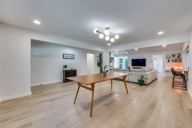 a view of a livingroom with furniture and a flat screen tv