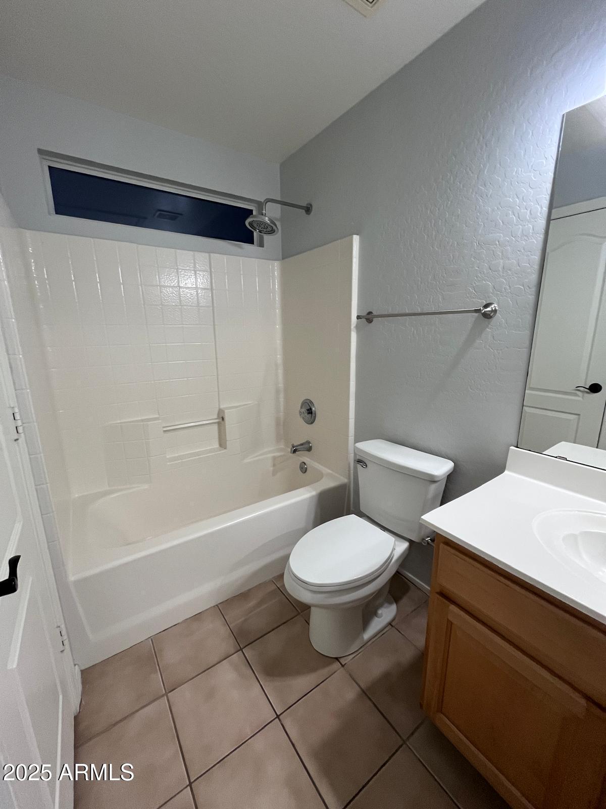 18835 North 16th Place Phoenix, AZ 85024 - Photo 11 of 18 a bathroom with a sink a toilet a mirror and a bathtub