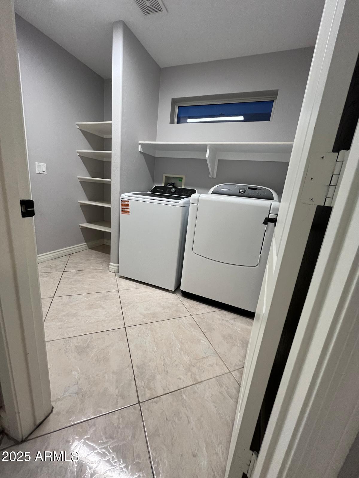 18835 North 16th Place Phoenix, AZ 85024 - Photo 17 of 18 a utility room with washer and dryer