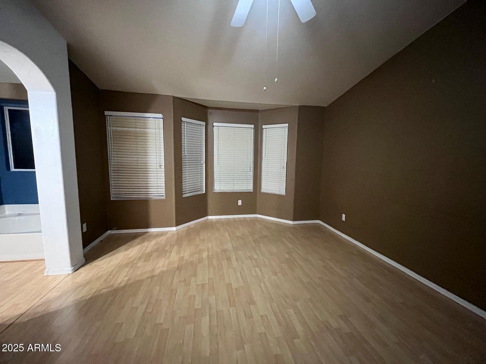 18835 North 16th Place Phoenix, AZ 85024 - Photo 7 of 18 a view of an empty room with a window