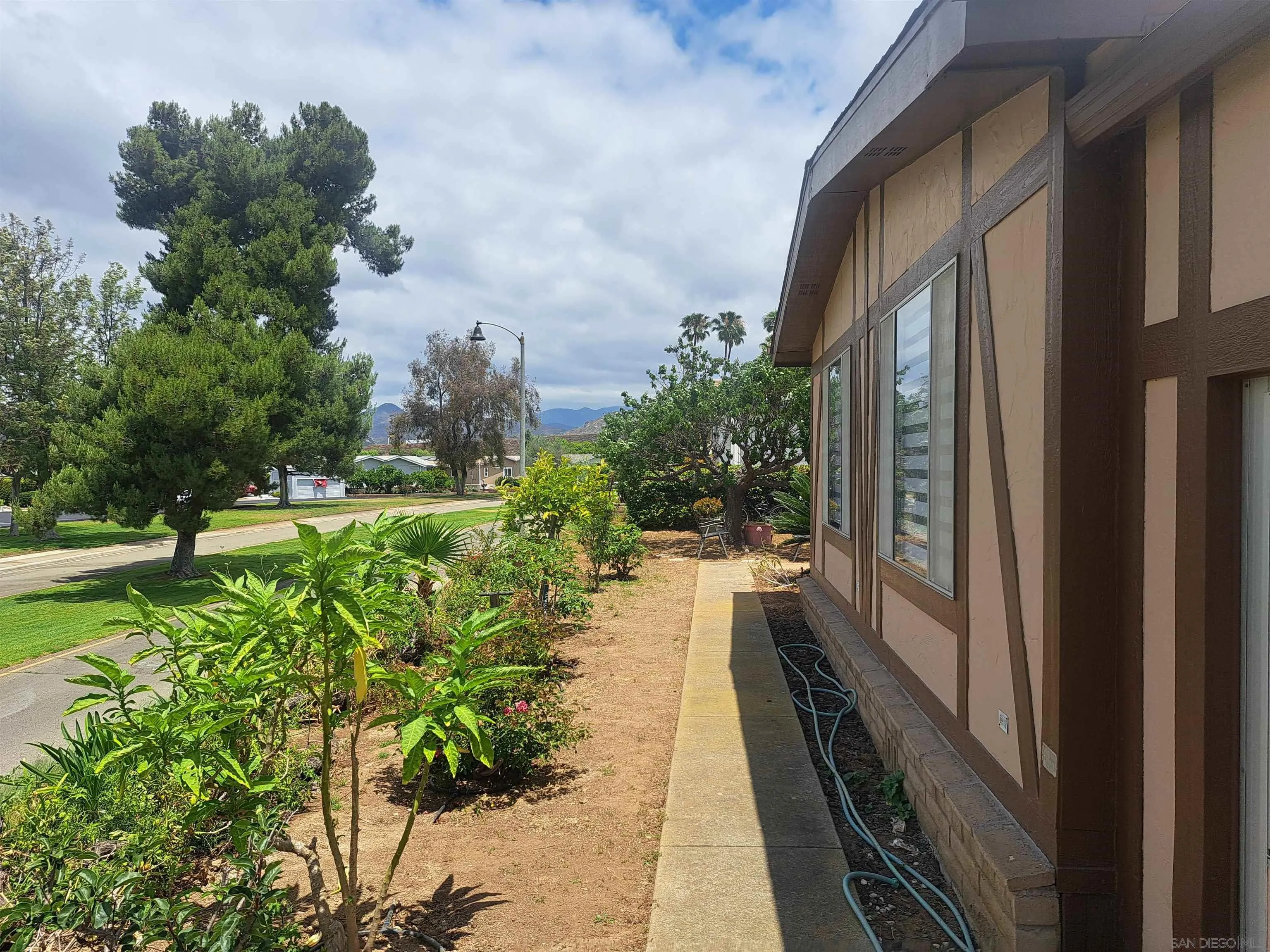 4650 Dulin Road, Unit 12 Fallbrook, CA 92003 - Photo 4 of 36 a view of a house with a yard