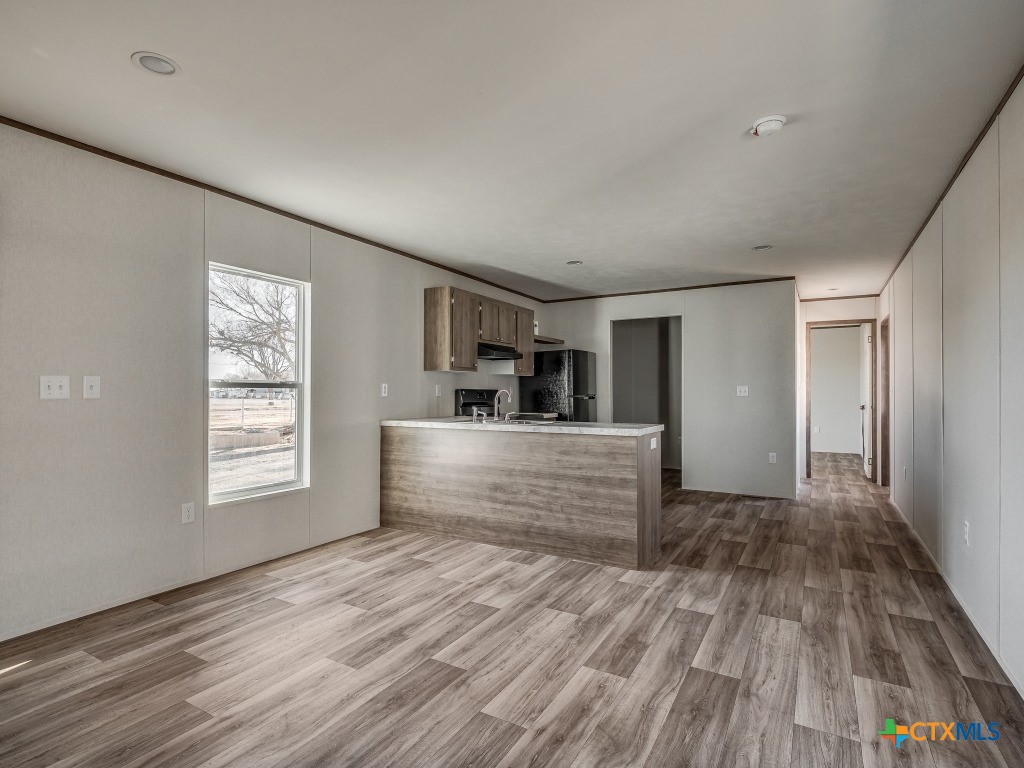 352 Trammel Road Eddy, TX 76524 - Photo 5 of 11 a view of a room with window and wooden floor