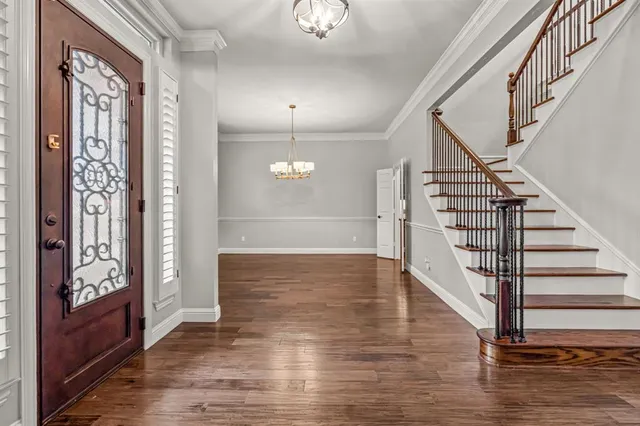 a view of an entryway with wooden floor