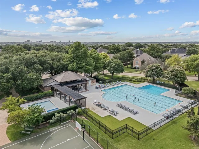 an aerial view of a house with garden space and street view
