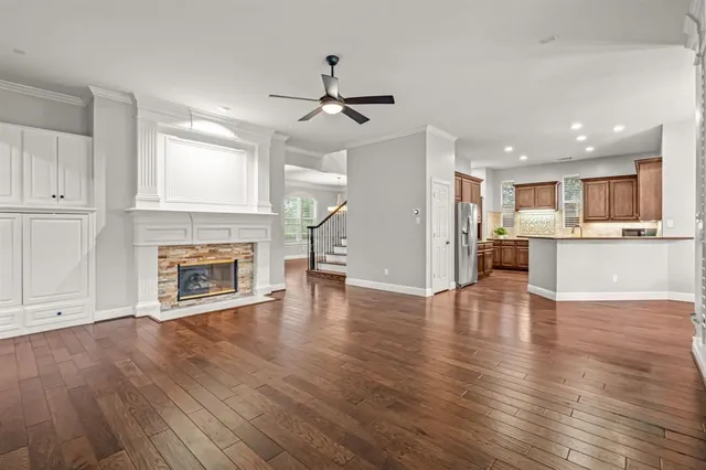 a view of a kitchen with wooden floor and a kitchen