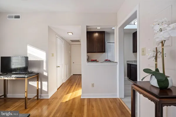 a view of kitchen with sink microwave and refrigerator