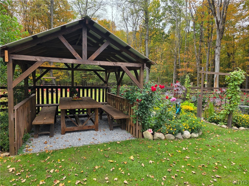 1053 Grant Road Russia, NY 13324 - Photo 32 of 47 A rustic wooden pavilion stands alongside a colorf