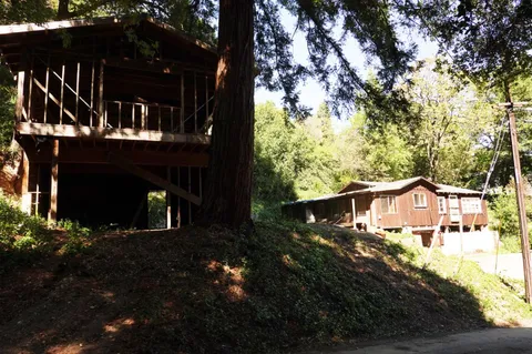 a view of house with yard