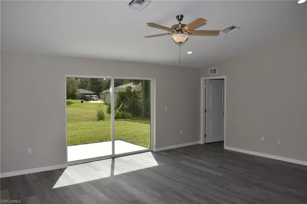 a view of an entryway with wooden floor