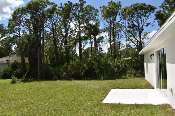 a view of backyard with green space