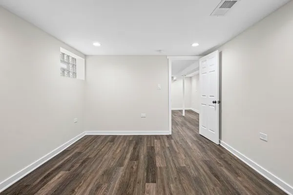 a view of hallway with wooden floor