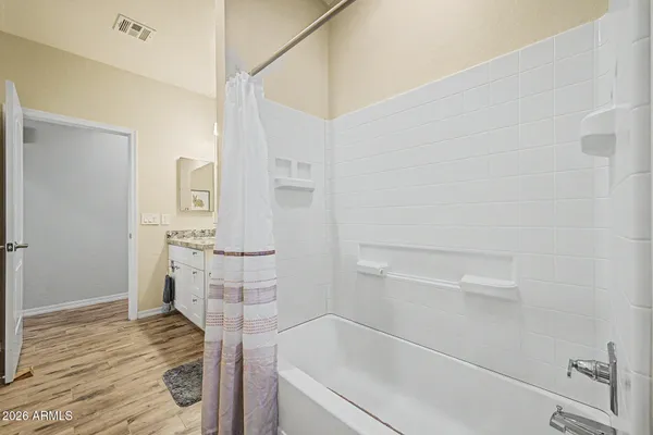 a bathroom with a bathtub and a shower