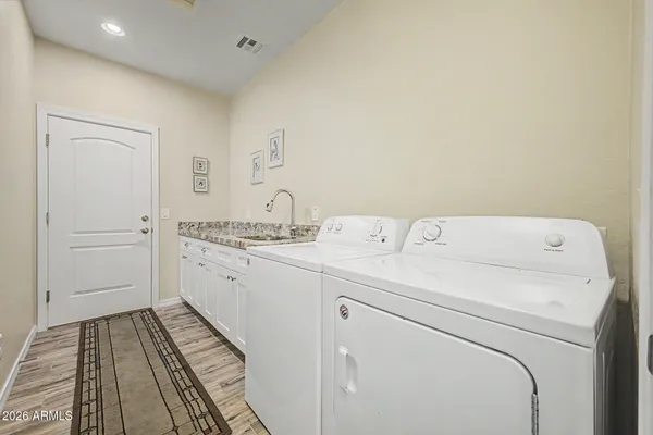 a utility room with dryer and washer