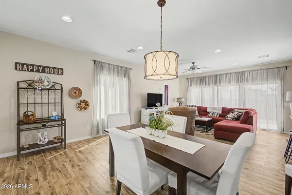 a view of a dining room with furniture window and wooden floor