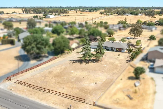 aerial view of residential houses with outdoor space