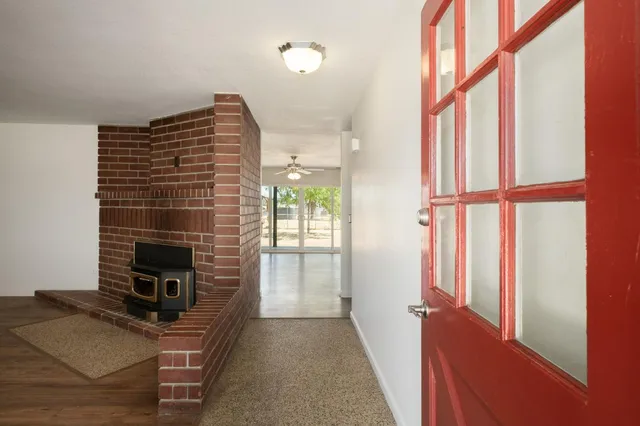 a view of a livingroom with furniture and a fireplace