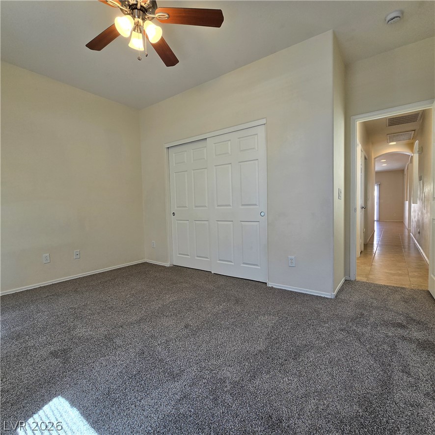 9234 Kingston Road Henderson, NV 89074 - Photo 24 of 38 A well-proportioned bedroom with ample natural light offers a comfortable retreat.