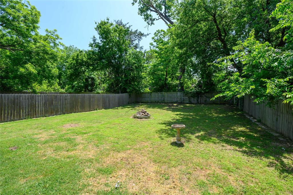 318 Munson Street Denison, TX 75021 - Photo 20 of 21 a view of garden with wooden fence