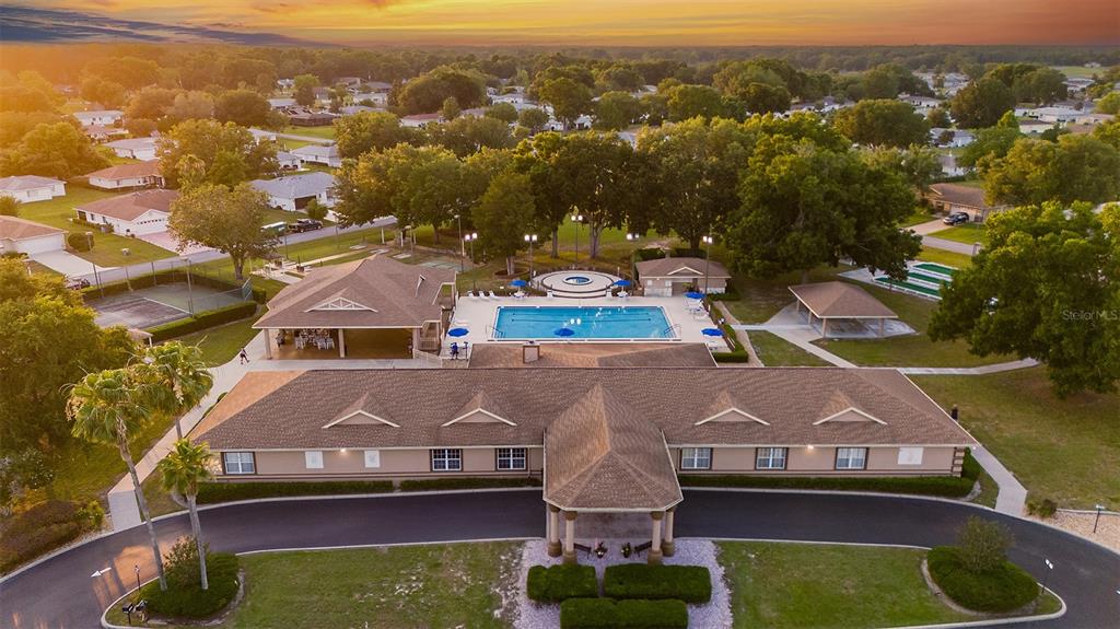 6144 Southwest 97th Street Ocala, FL 34476 - Photo 26 of 33 an aerial view of house with yard swimming pool and mountains