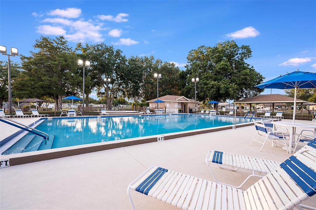 6144 Southwest 97th Street Ocala, FL 34476 - Photo 29 of 33 a view of swimming pool with outdoor seating