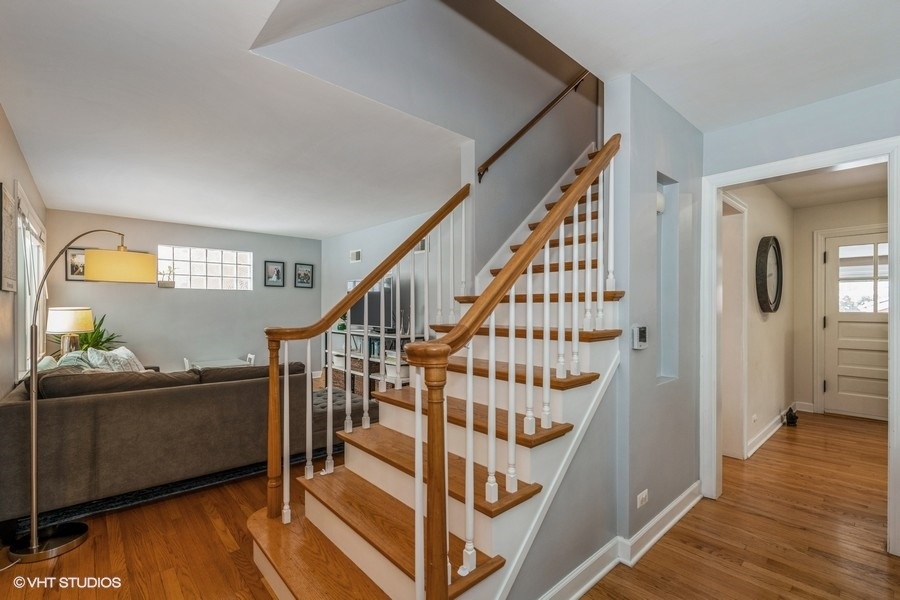 130 Northgate Road Riverside, IL 60546 - Photo 5 of 18 a view of entryway with wooden floor and windows