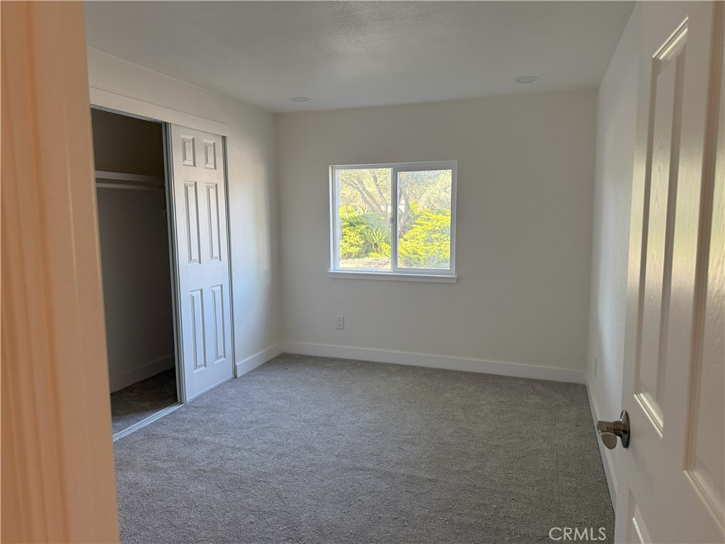 3835 Gardiner Ferry Road, Unit 98 Corning, CA 96021 - Photo 6 of 11 an empty room with windows