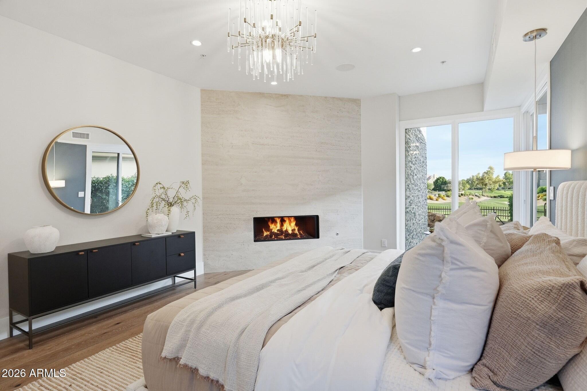 7475 East Gainey Ranch Road, Unit 7 Scottsdale, AZ 85258 - Photo 34 of 77 a bedroom with a large bed and a large mirror