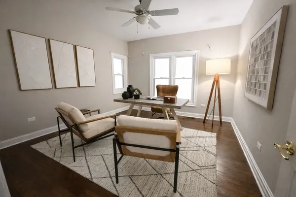a work room with furniture and a window