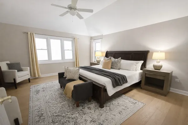 a bedroom with a bed and couch