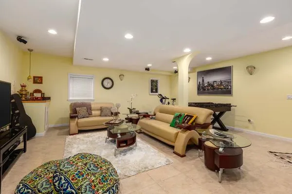 a living room with furniture and a rug