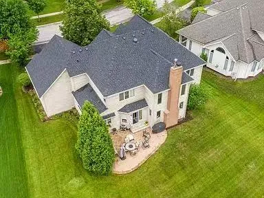 an aerial view of a house with garden