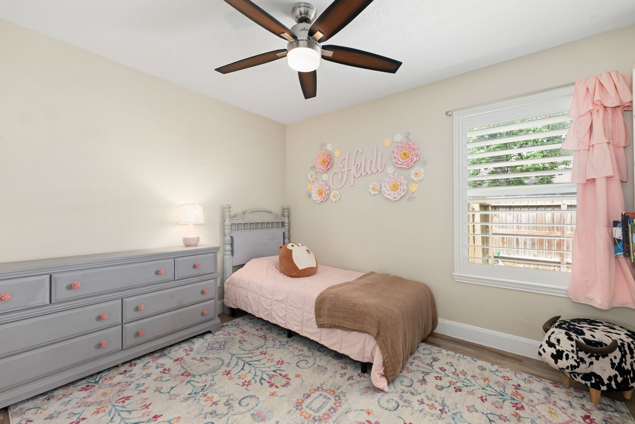 1915 Mercoal Drive Spring, TX 77386 - Photo 25 of 50 Comfortable bedroom with large windows, ceiling fan, and ample space for family or guests.