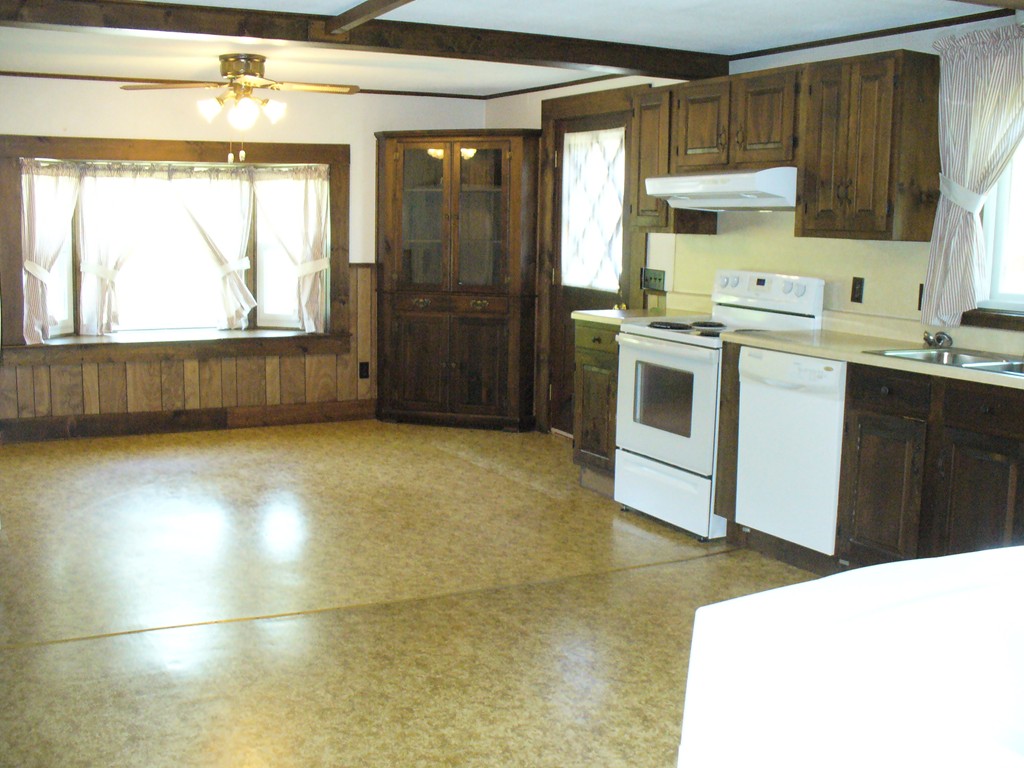 358 Palmer Road Ware, MA 01082 - Photo 3 of 30 a kitchen with stainless steel appliances a stove a sink and a refrigerator