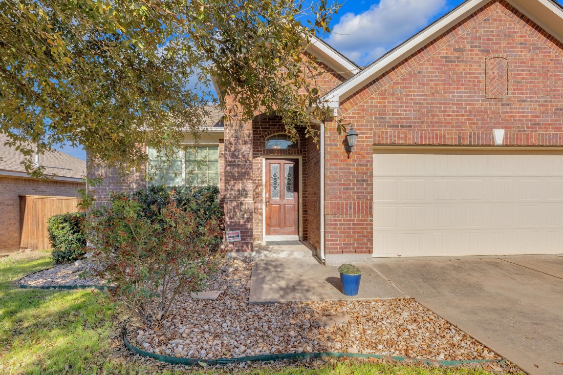 229 Caddo Lake Drive Georgetown, TX 78628 - Photo 1 of 1 a front view of a house with garden