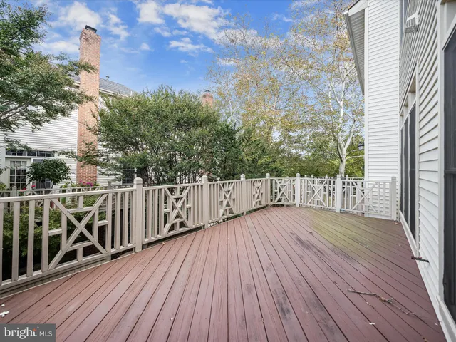 a view of wooden deck and a garden