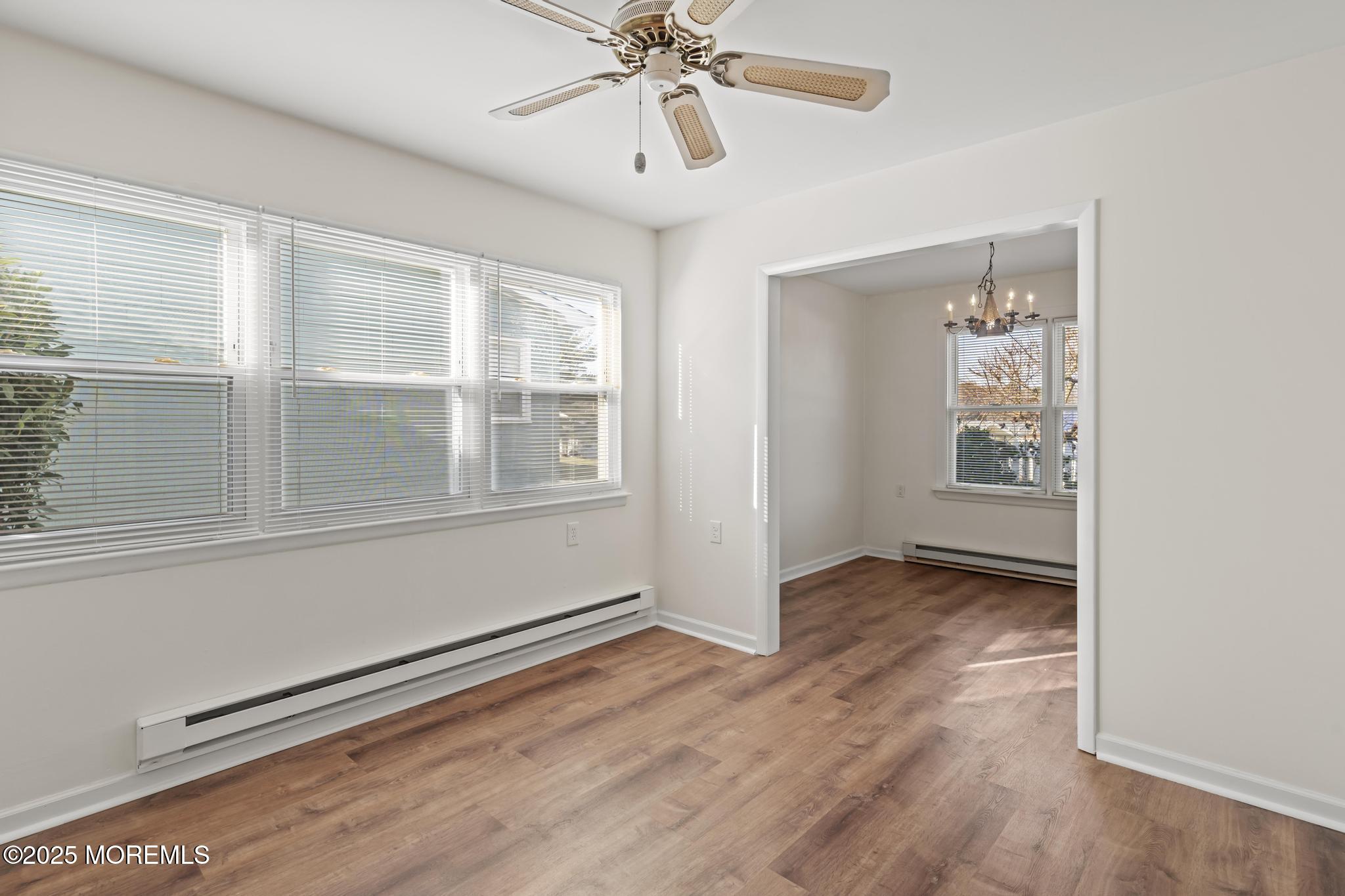 43 Patmore Road Brick, NJ 08724 - Photo 11 of 36 a view of an empty room with wooden floor and a window