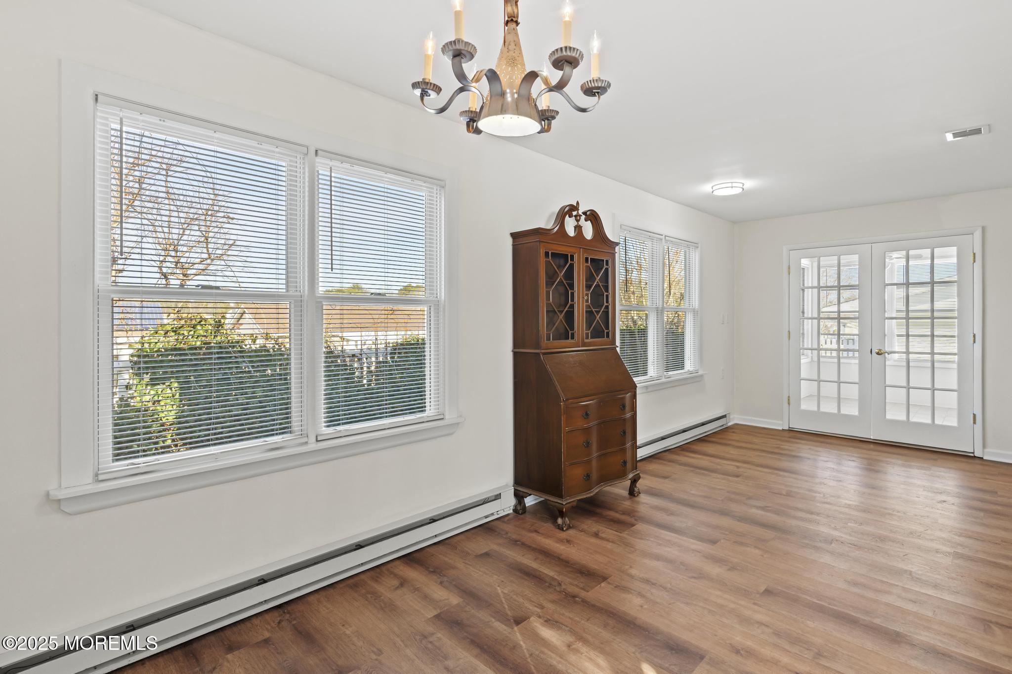 43 Patmore Road Brick, NJ 08724 - Photo 13 of 36 a view of an empty room with a window and wooden floor