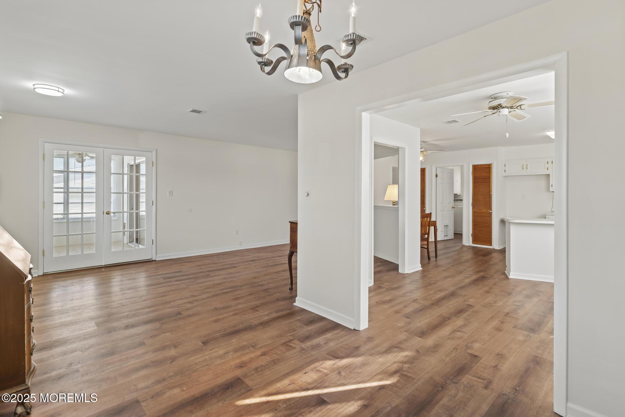 43 Patmore Road Brick, NJ 08724 - Photo 14 of 36 a view interior of a house with wooden floor and a chandelier