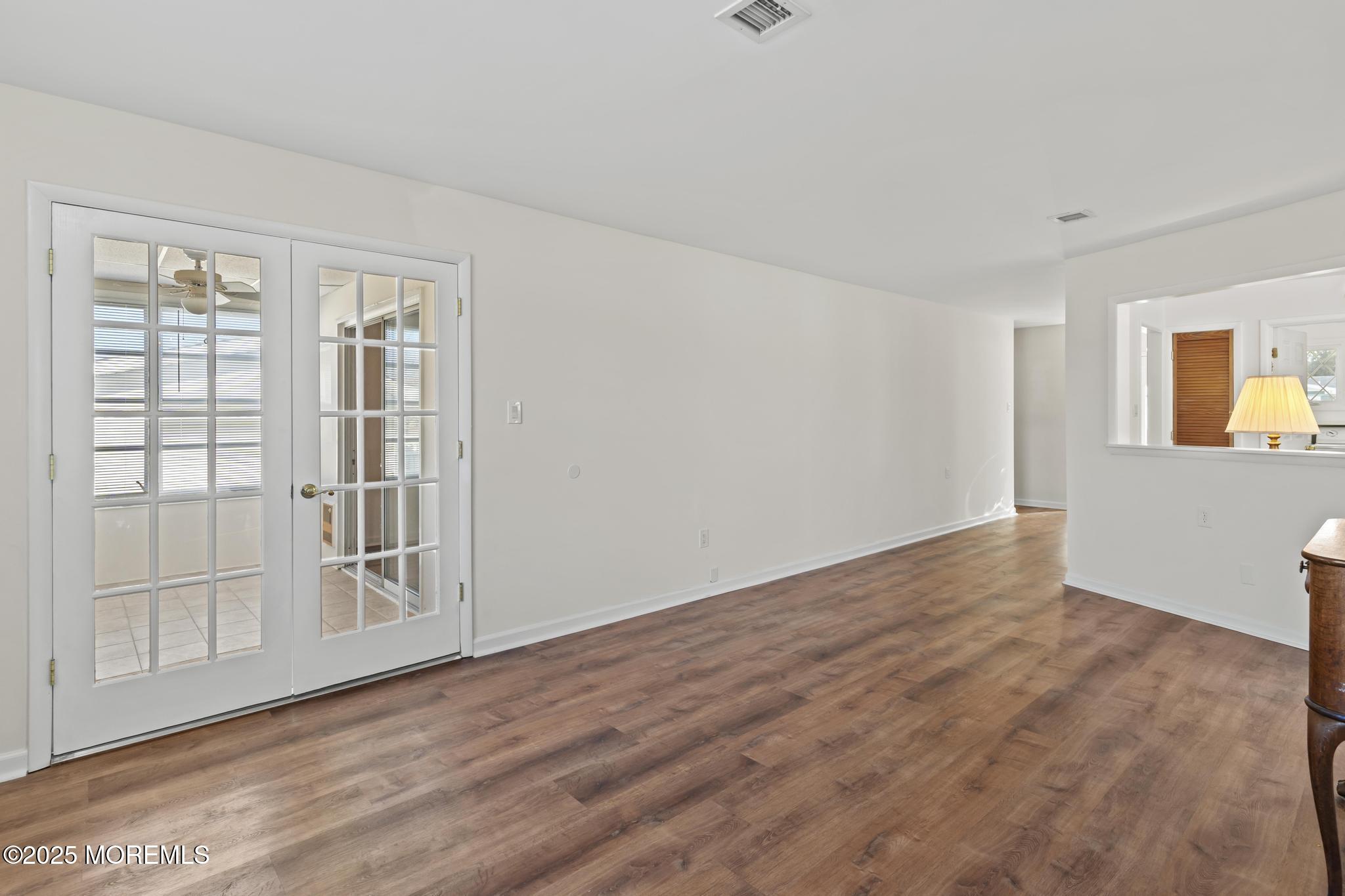 43 Patmore Road Brick, NJ 08724 - Photo 15 of 36 a view of an empty room with wooden floor and a window