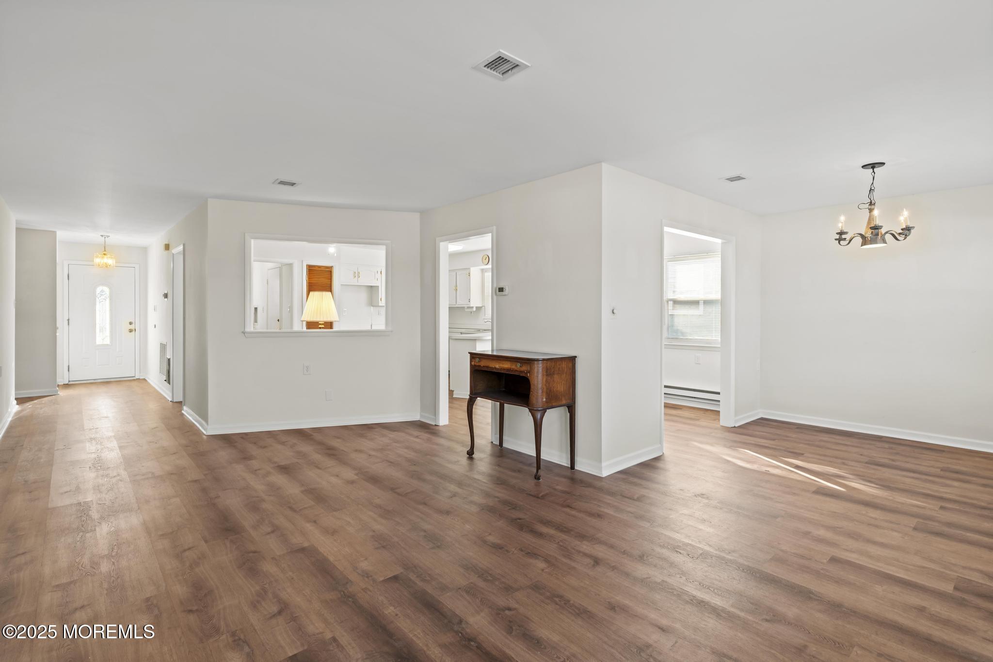 43 Patmore Road Brick, NJ 08724 - Photo 17 of 36 a view of empty room with wooden floor and windows