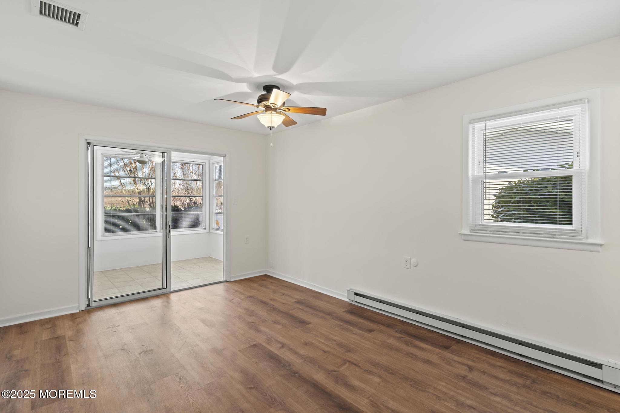 43 Patmore Road Brick, NJ 08724 - Photo 22 of 36 wooden floor in an empty room with a window