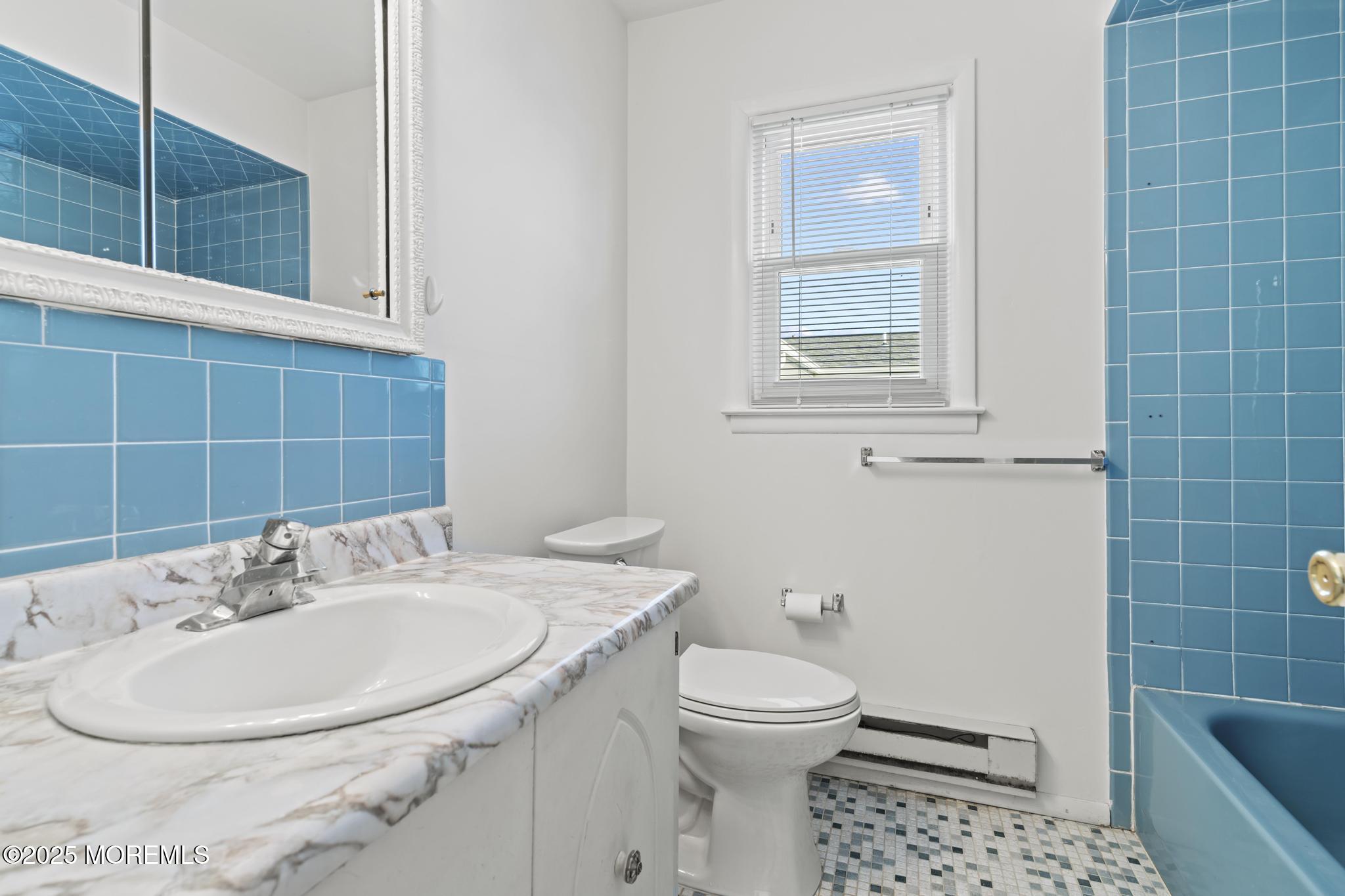 43 Patmore Road Brick, NJ 08724 - Photo 30 of 36 a bathroom with a sink a toilet and shower