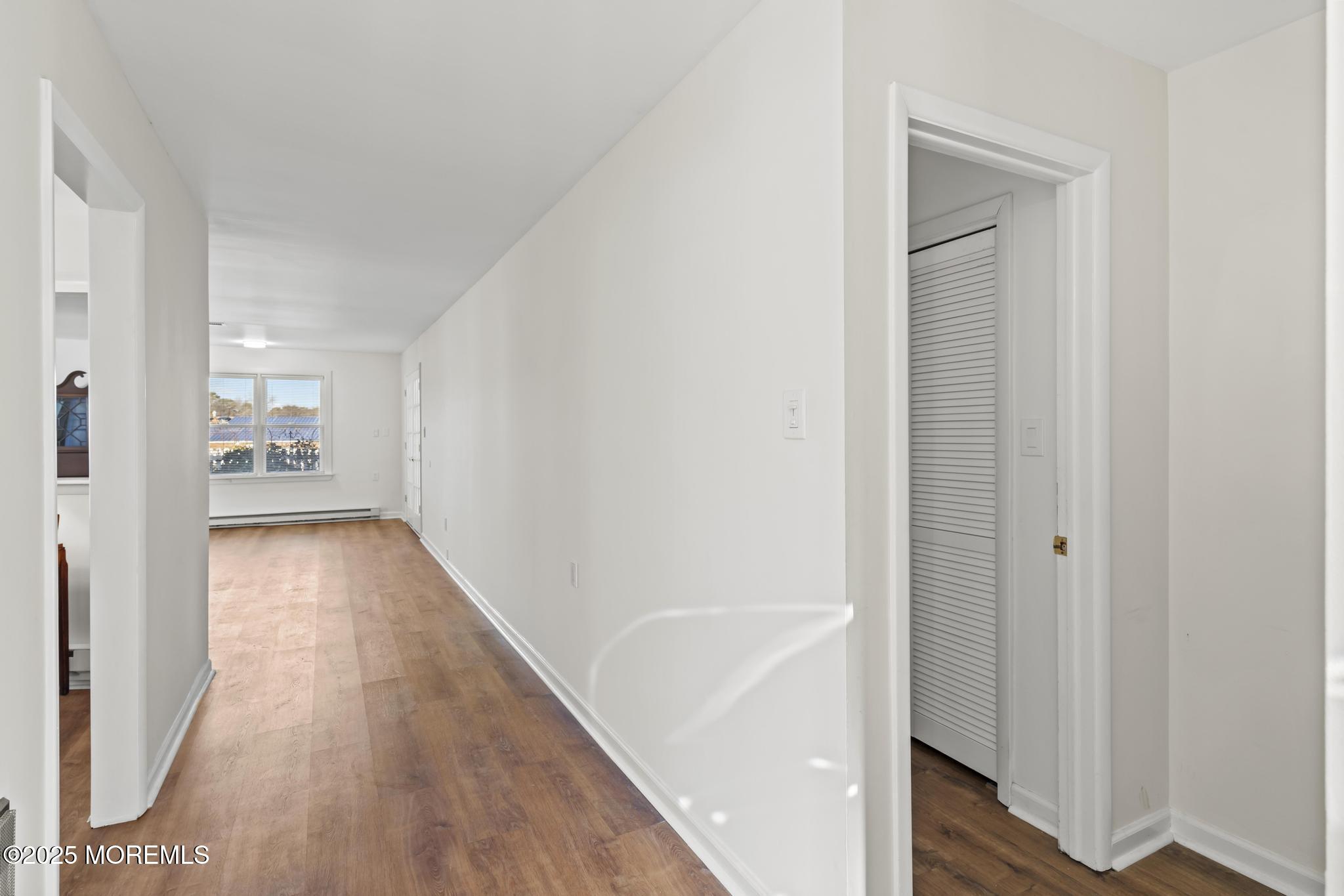 43 Patmore Road Brick, NJ 08724 - Photo 4 of 36 a view of a hallway with wooden floor and closet